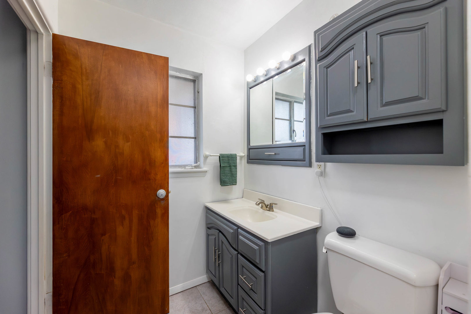 313 Jackson Street Park Forest, IL 60466 - Photo 10 of 22 a bathroom with a sink a toilet and shower