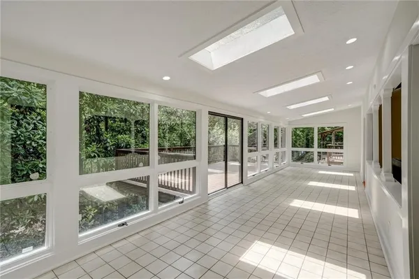 a view of an entryway with wooden floor