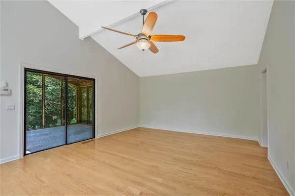 a view of a chairs and table on the wooden floor
