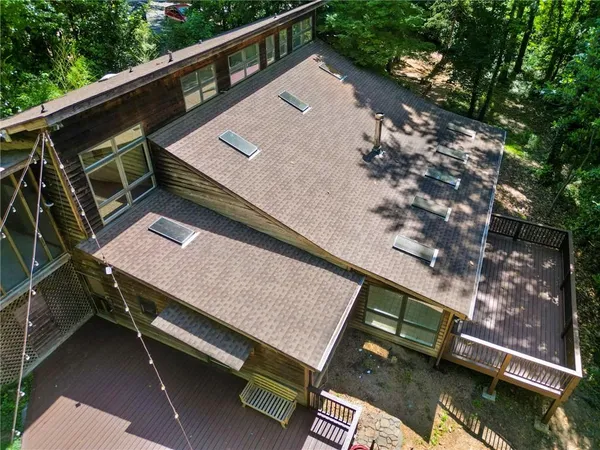 an aerial view of a house with a yard