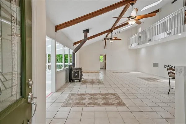 a view of entryway and hall with a dining table