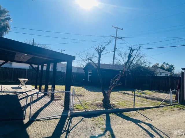 a view of a backyard of the house