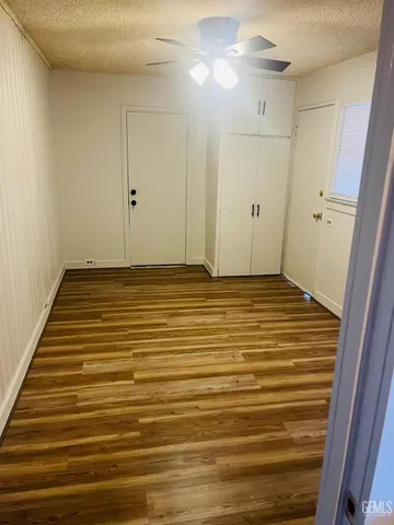 a view of a room with wooden floor and stairs