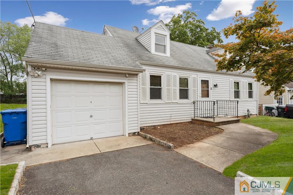 8 Longfellow Drive Colonia, NJ 07067 - Photo 1 of 25 front view of a house with a yard
