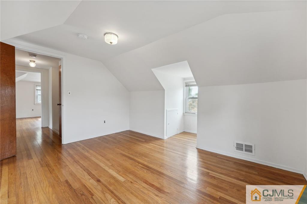 8 Longfellow Drive Colonia, NJ 07067 - Photo 16 of 25 a view of an empty room and wooden floor