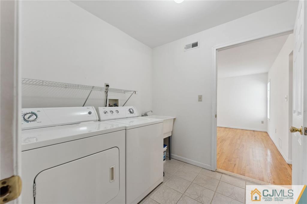 8 Longfellow Drive Colonia, NJ 07067 - Photo 21 of 25 a utility room with dryer and washer