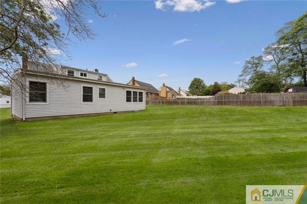 8 Longfellow Drive Colonia, NJ 07067 - Photo 23 of 25 a front view of a house with a yard