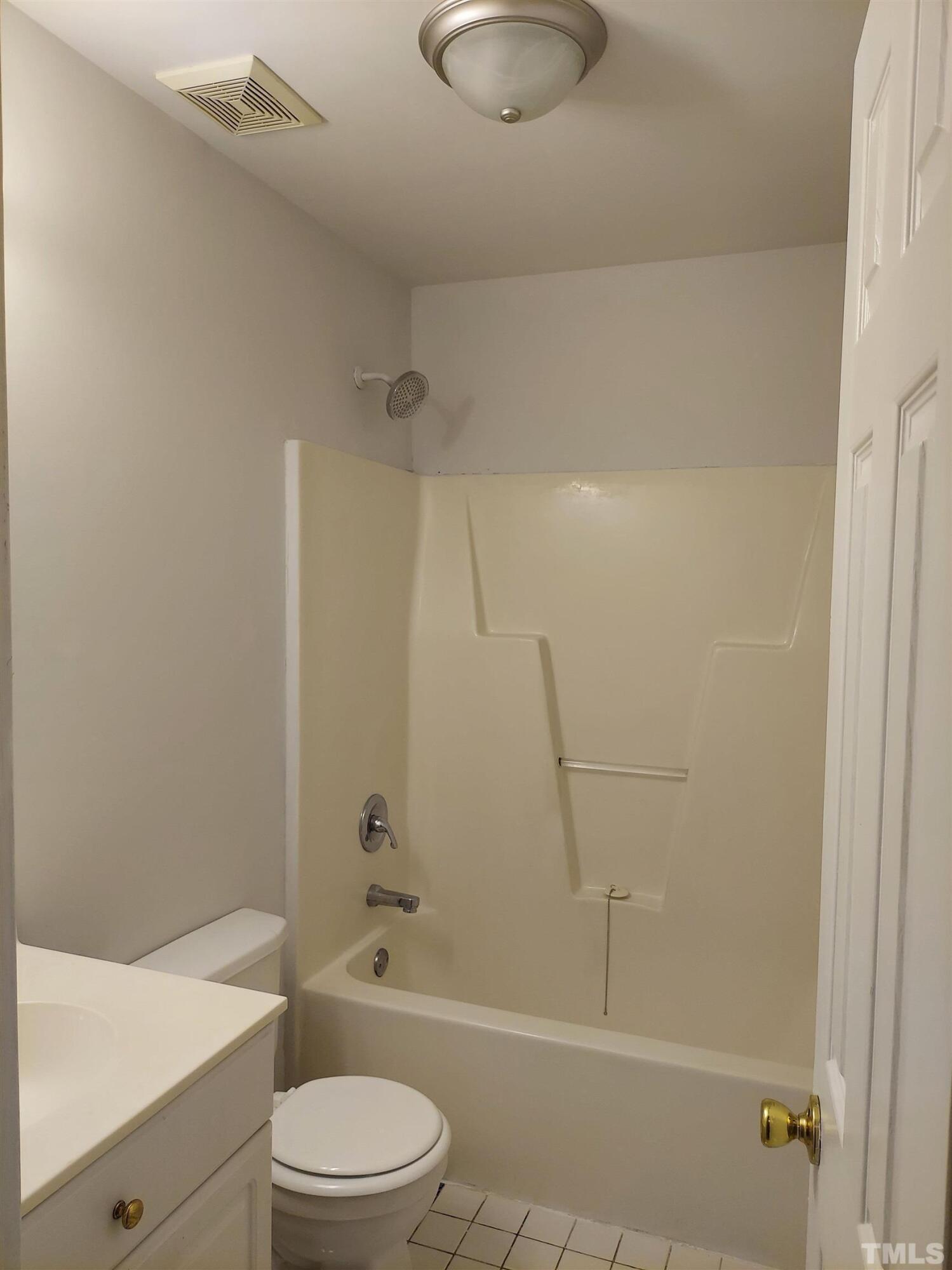 224 Crossfire Road Holly Springs, NC 27540 - Photo 27 of 43 a bathroom with a granite countertop bathtub shower sink vanity and toilet