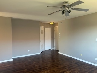 717 East Whispering Oaks Drive, Unit 2RR Palatine, IL 60074 - Photo 2 of 11 a view of an empty room with wooden floor