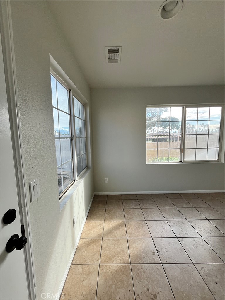 1004 South Riverside Avenue, Unit C1 Rialto, CA 92376 - Photo 2 of 19 a view of an empty room with a window