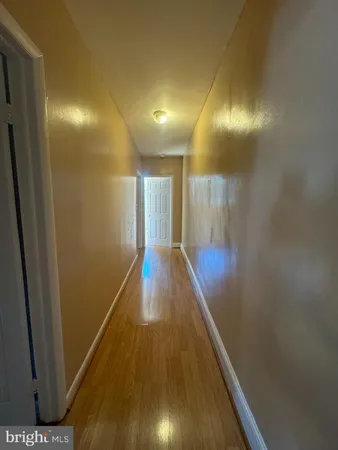 a view of gallery with wooden floor