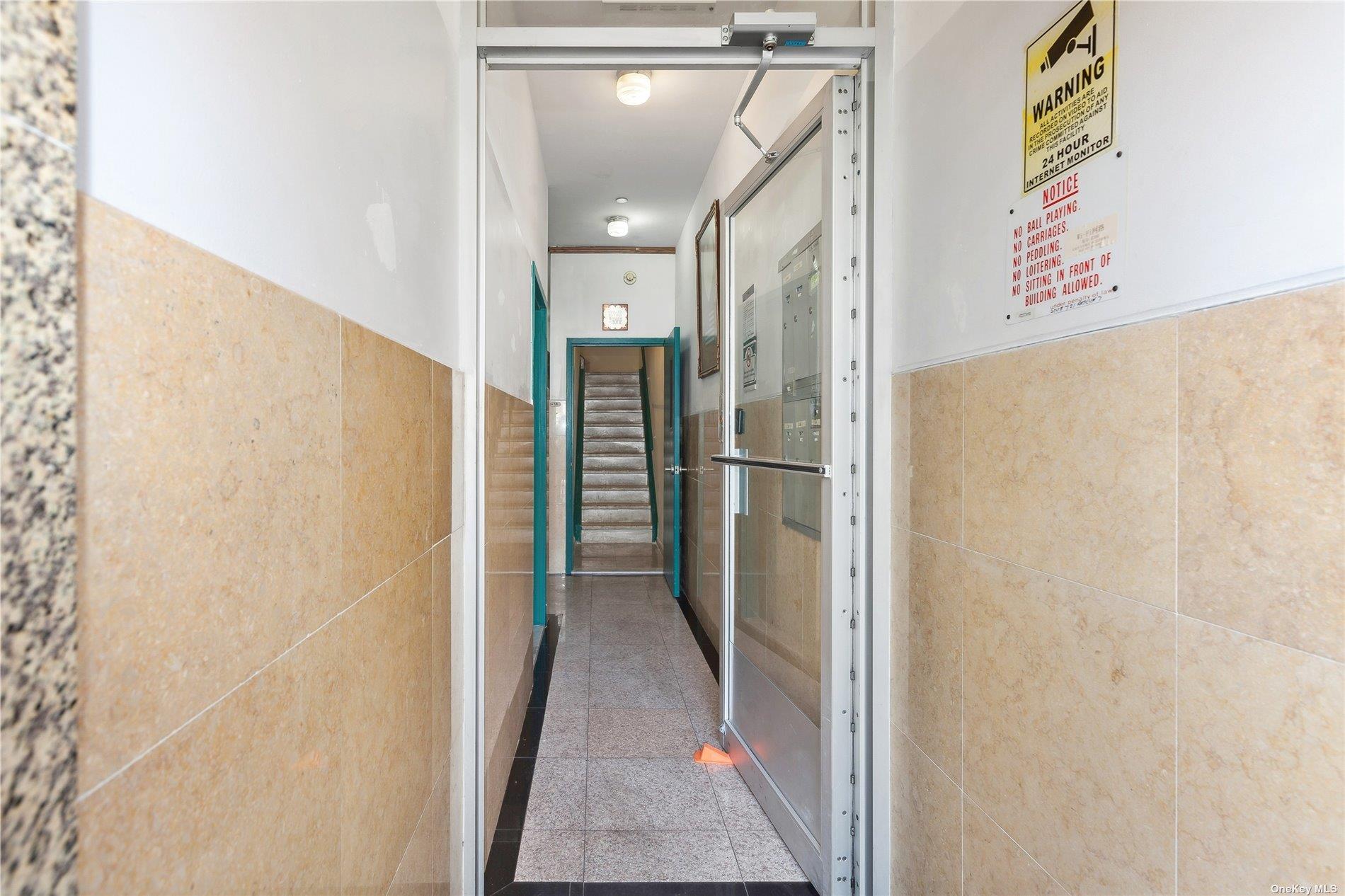 42-38 Judge Street, Unit 2A Queens, NY 11373 - Photo 13 of 14 a view of a hallway with a refrigerator