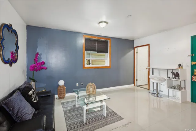 a living room with furniture and a table