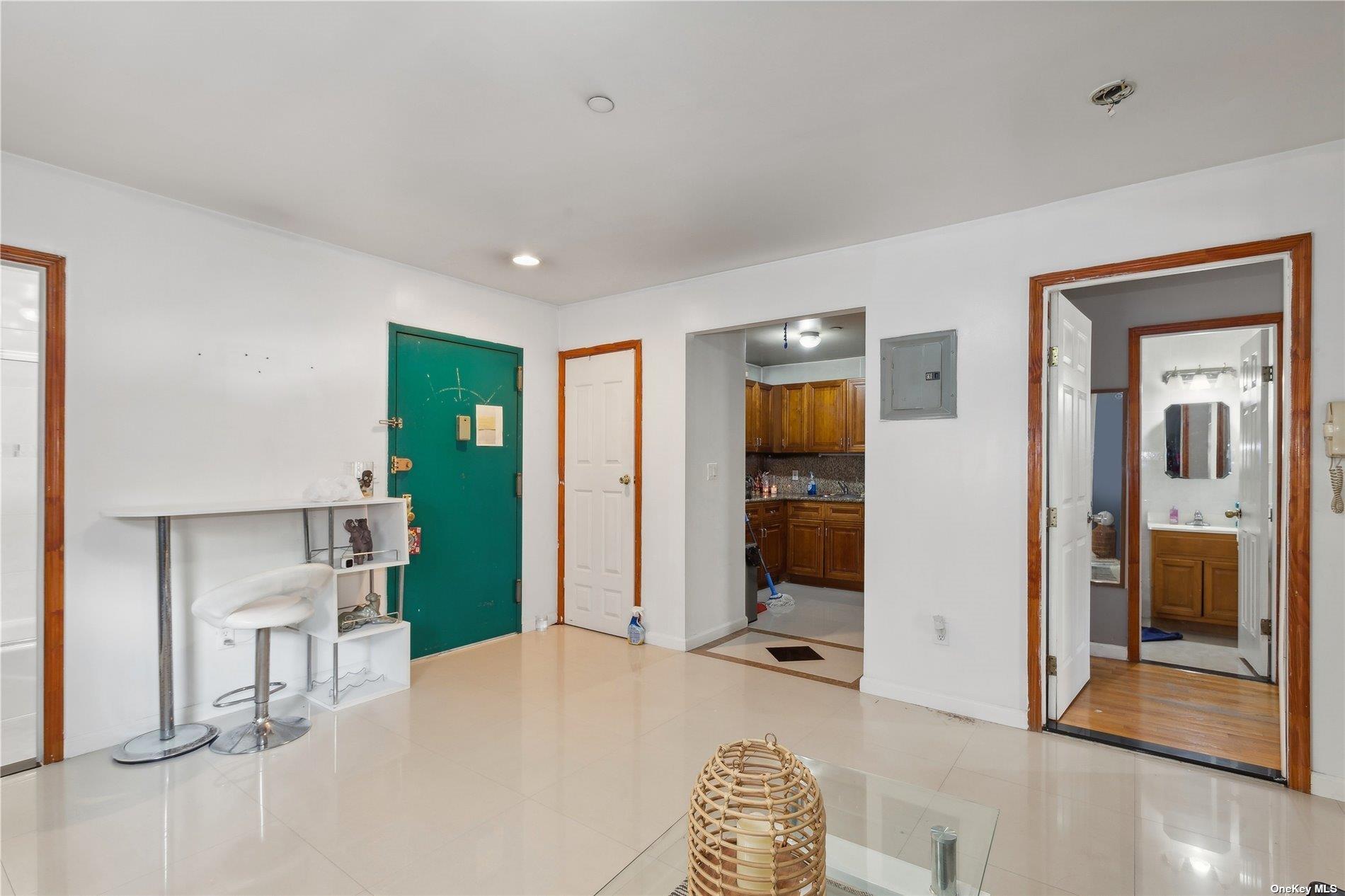 42-38 Judge Street, Unit 2A Queens, NY 11373 - Photo 4 of 14 a bedroom with a bed and glass door