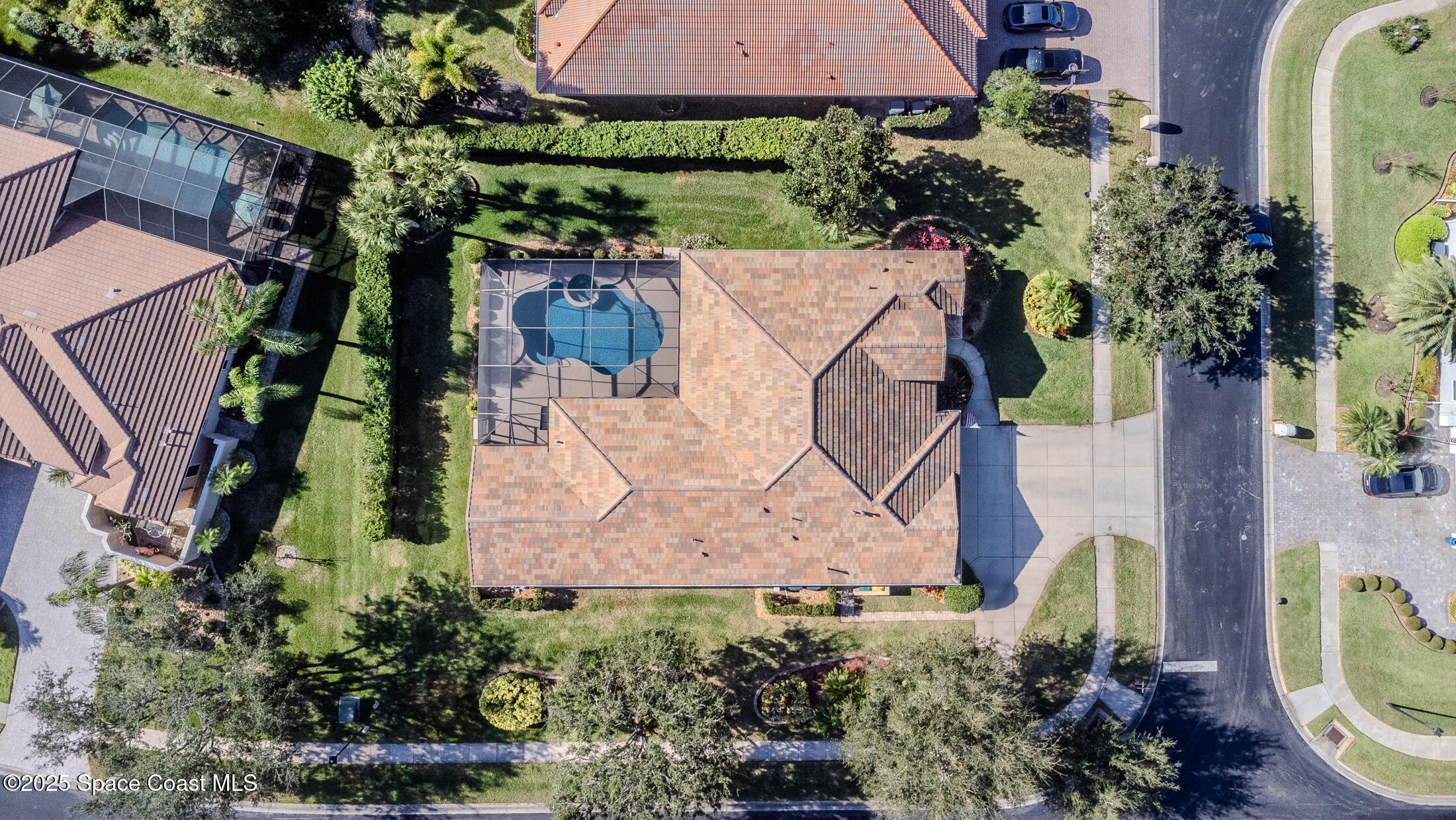 8201 Compton Way Melbourne, FL 32940 - Photo 4 of 52 an aerial view of a house with garden space and street view