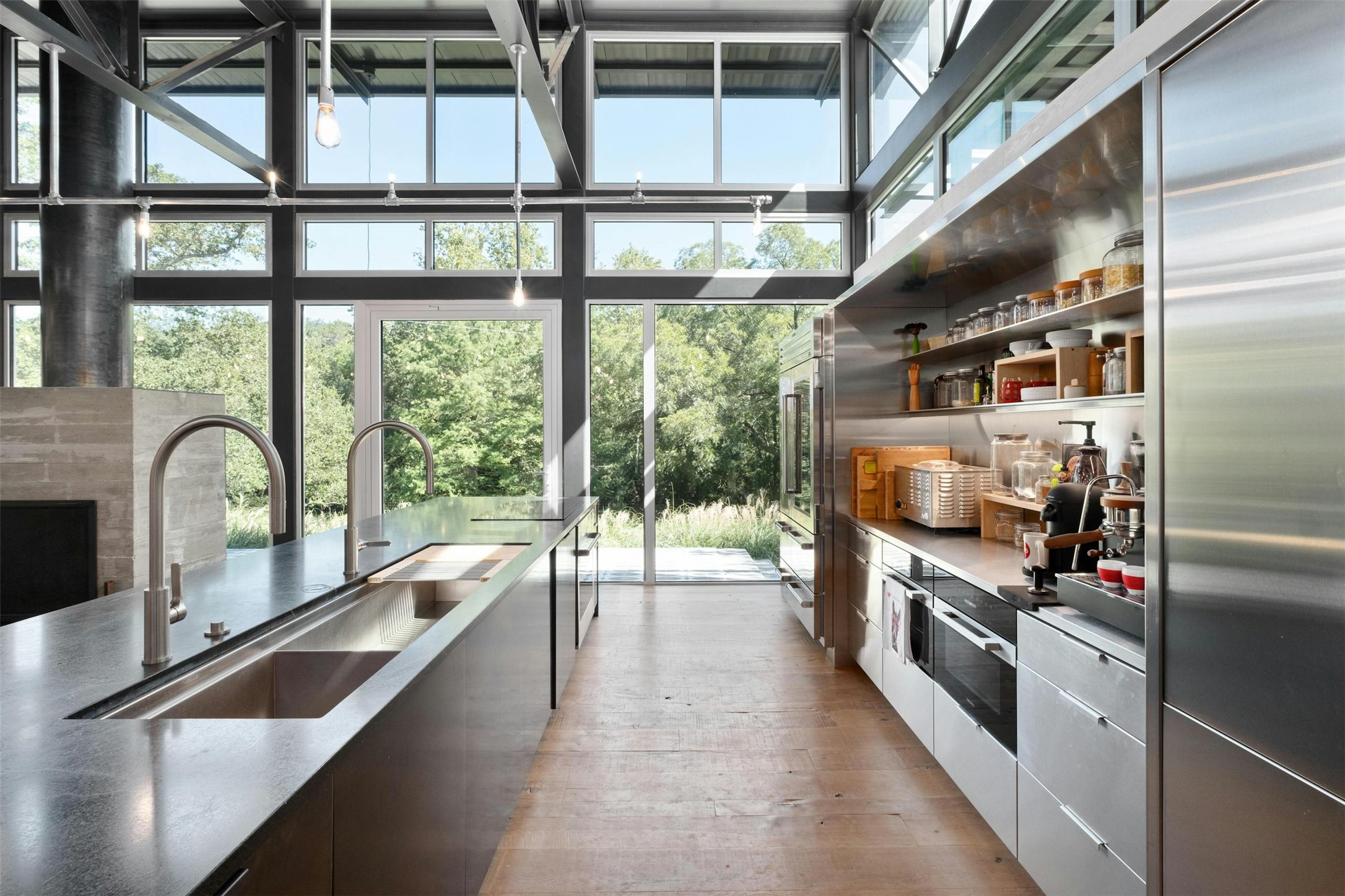2212 River Hills Road Austin, TX 78733 - Photo 14 of 40 a kitchen with stainless steel appliances granite countertop a stove and a sink
