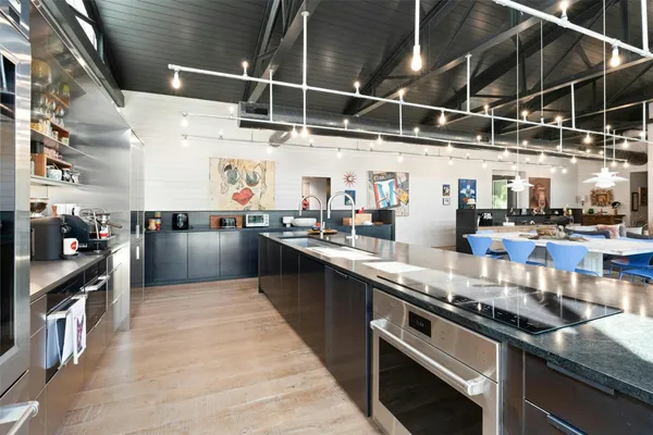 a kitchen with stainless steel appliances granite countertop lots of counter top space