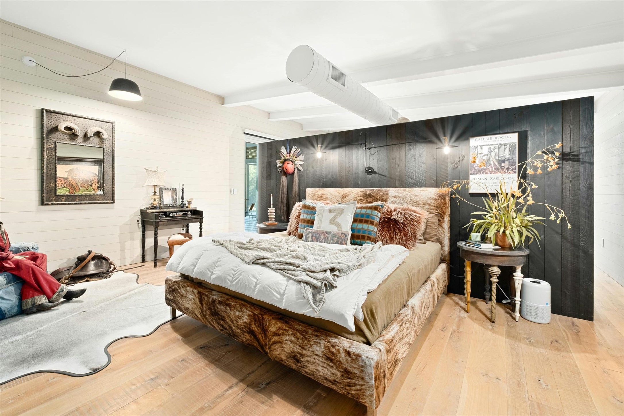 2212 River Hills Road Austin, TX 78733 - Photo 18 of 40 a large bed sitting in a bedroom and table