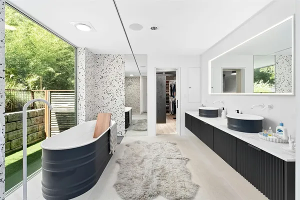 a bathroom with a shower and a sink