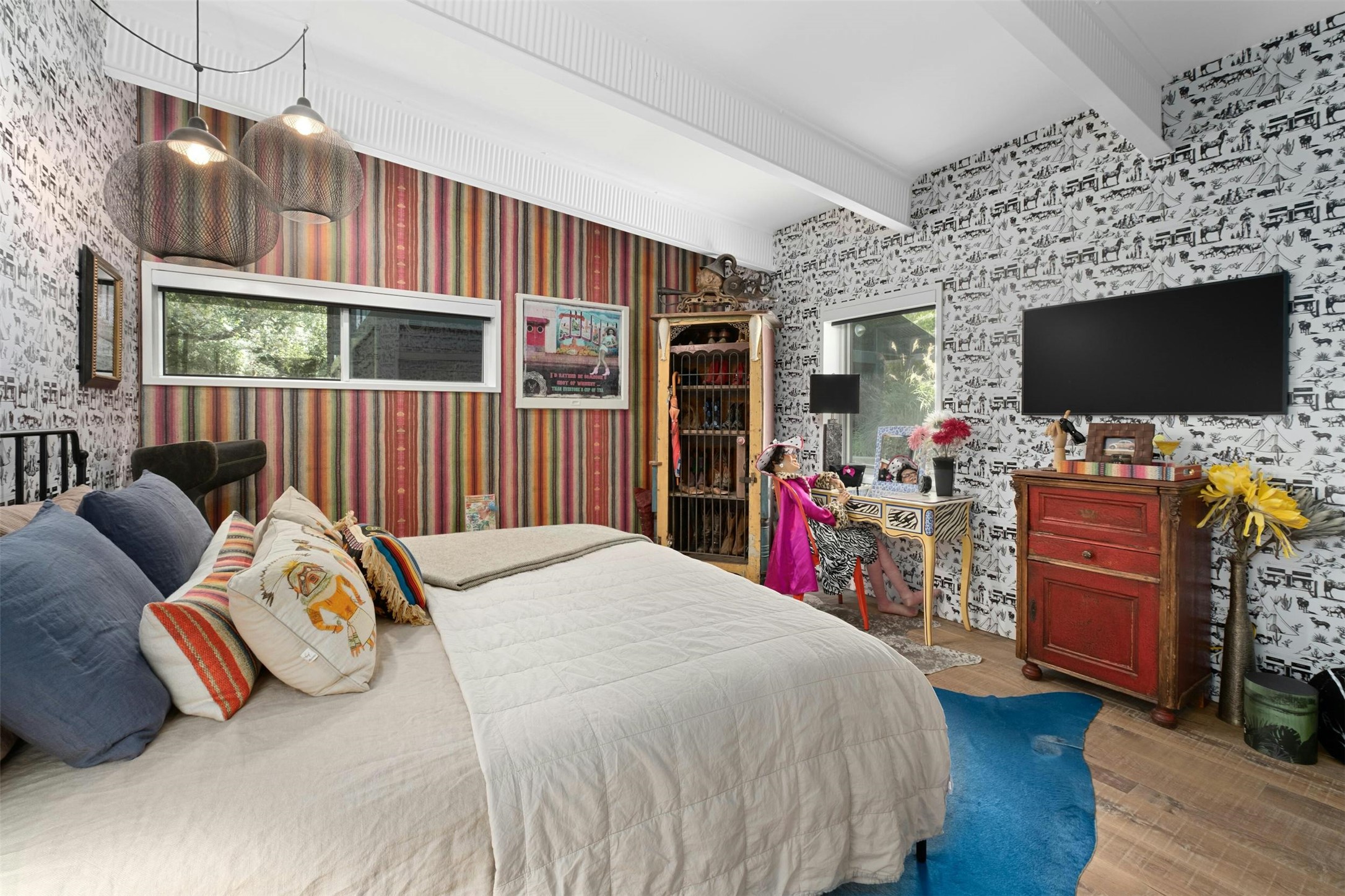 2212 River Hills Road Austin, TX 78733 - Photo 21 of 40 a bed room with a bed and a television