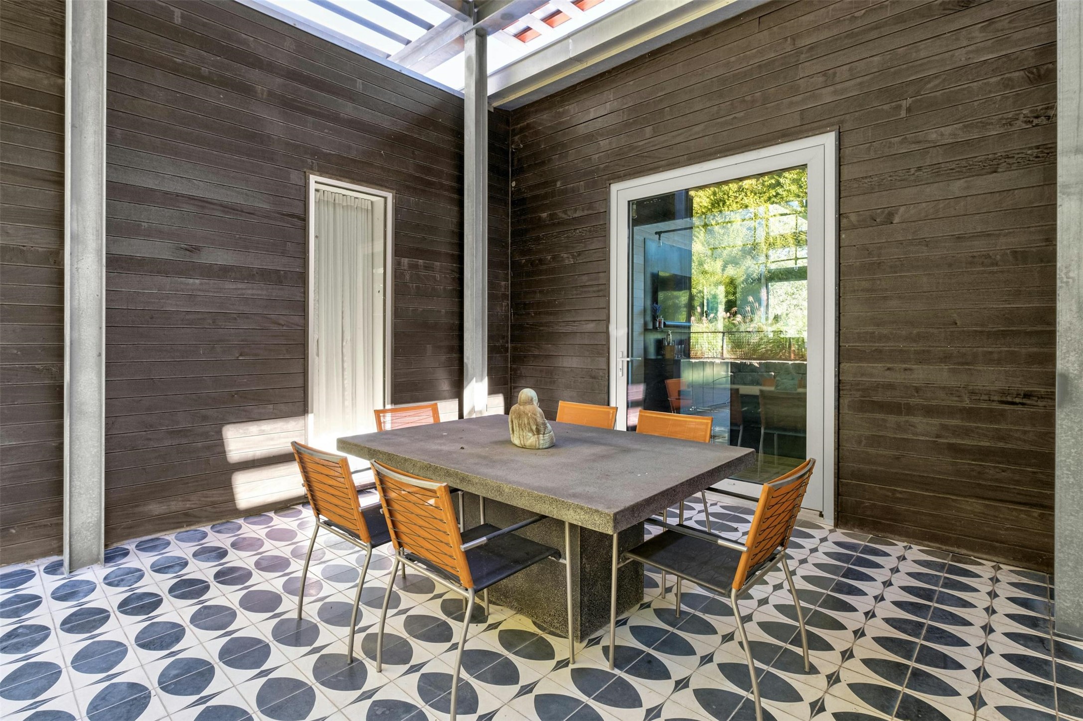 2212 River Hills Road Austin, TX 78733 - Photo 23 of 40 a view of a dinning table and chairs in patio