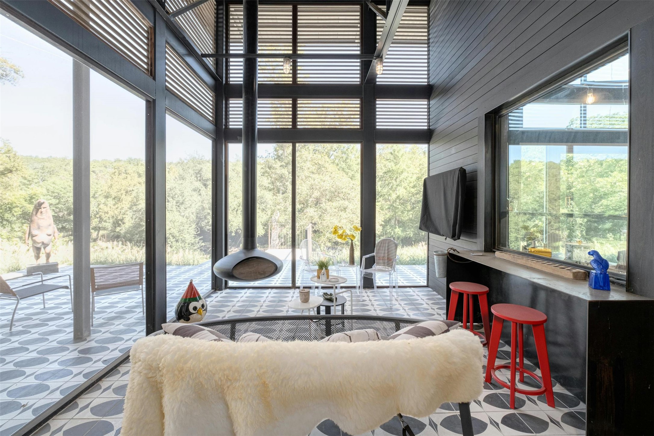 2212 River Hills Road Austin, TX 78733 - Photo 26 of 40 a dining room with fireplace furniture and a large window