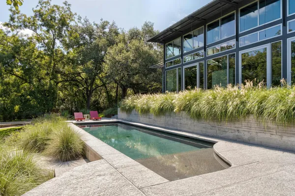 a wooden bench sitting in a roof deck