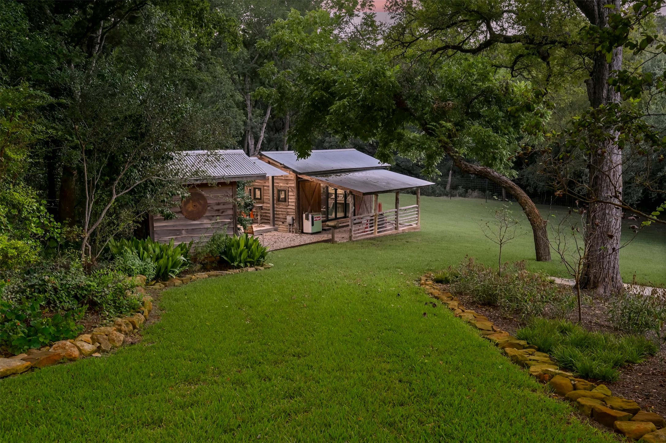 2212 River Hills Road Austin, TX 78733 - Photo 30 of 40 a view of a house with a yard table and chairs