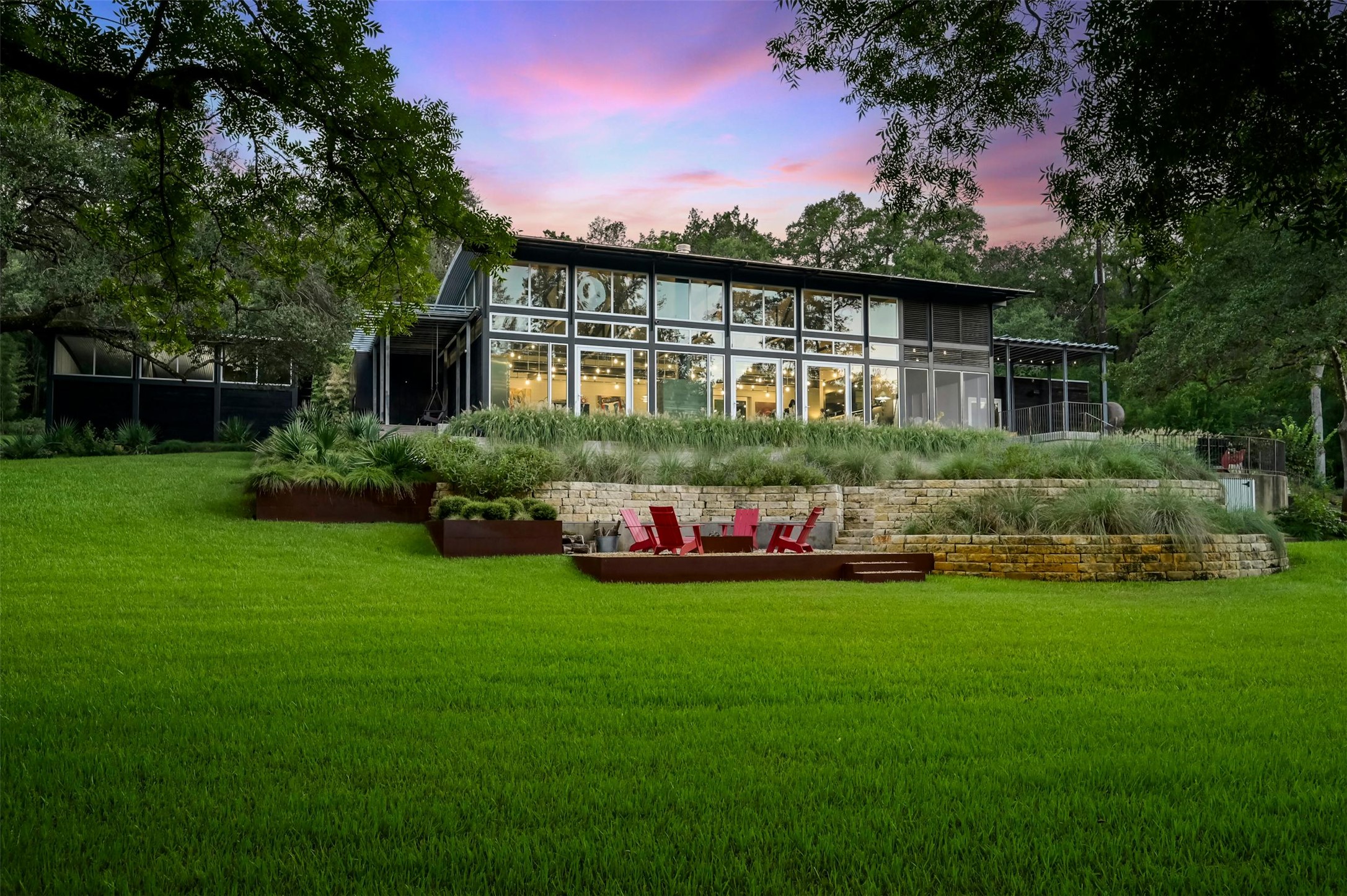 2212 River Hills Road Austin, TX 78733 - Photo 3 of 40 a view of front of house with a yard and potted plants