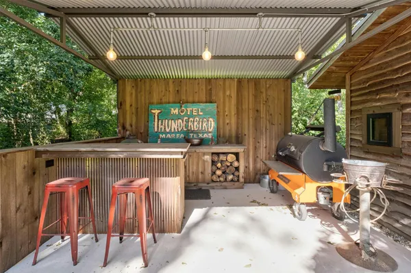 a living room with furniture a fireplace and a table