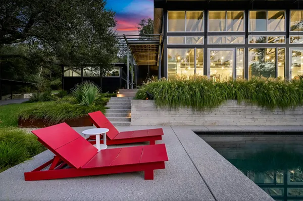 a view of a green field with lots of trees