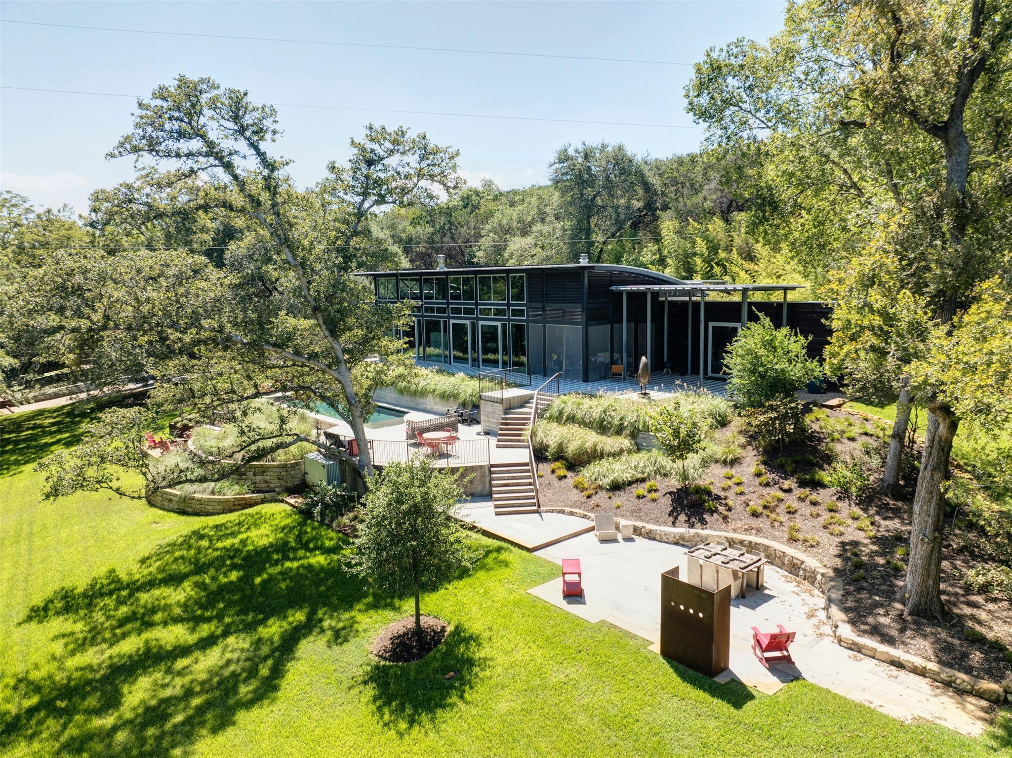 2212 River Hills Road Austin, TX 78733 - Photo 4 of 40 a view of backyard with plants and outdoor seating