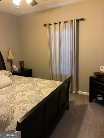 a bedroom with a bed and a closet