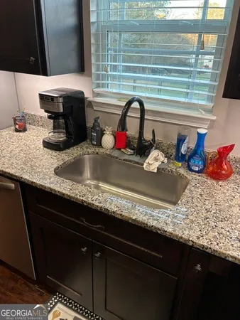 a kitchen with a stove and a refrigerator