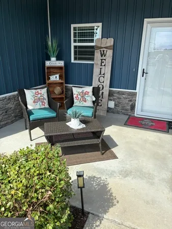 a view of backyard with seating space