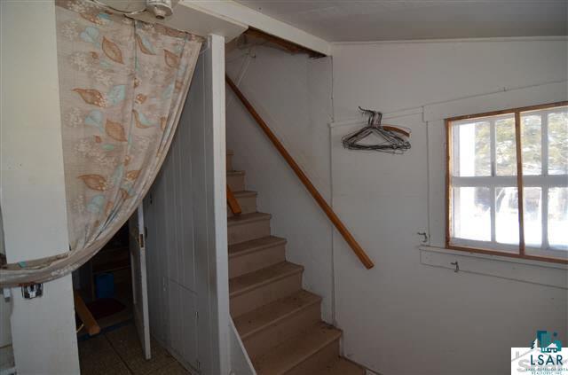 7389 East Crossover Road South Range, WI 54874 - Photo 13 of 25 Pantry with Stairs up to 2nd Floor