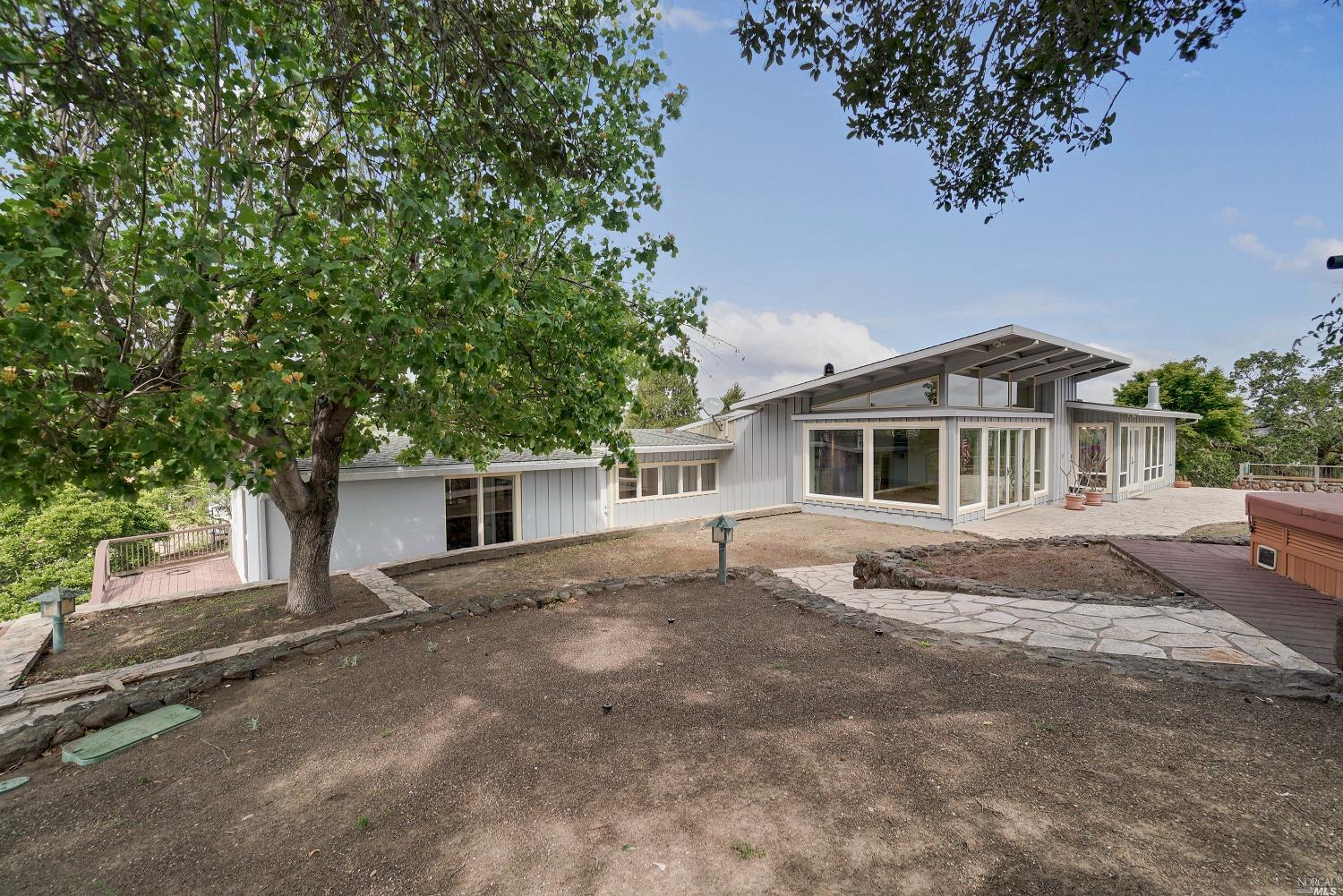 295 Bret Harte Road San Rafael, CA 94901 - Photo 1 of 1 a front view of a house with a garden