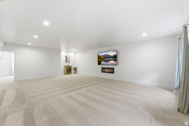 108 West Monte Rosa Lane Midway, UT 84049 - Photo 37 of 48 Spacious room featuring light-toned carpeting and recessed lighting