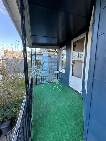 a view of porch with a big yard