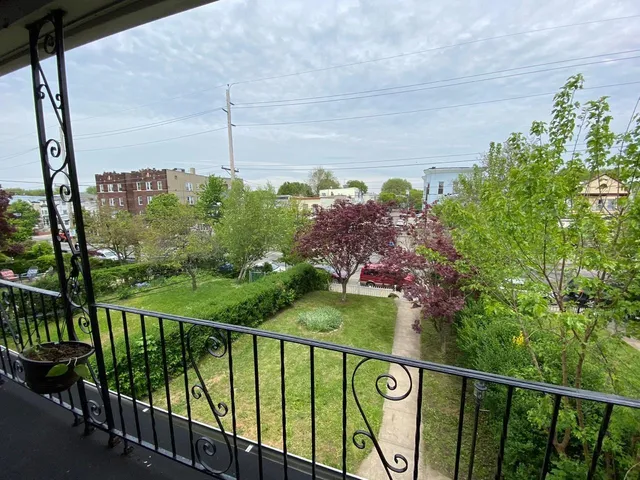 a view of a street from a balcony