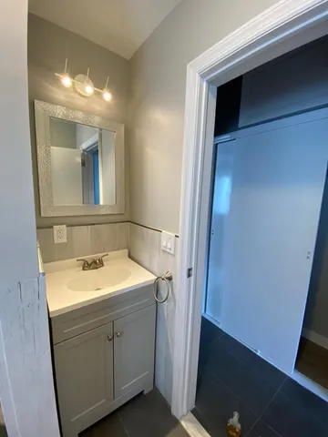 a bathroom with a sink and a mirror