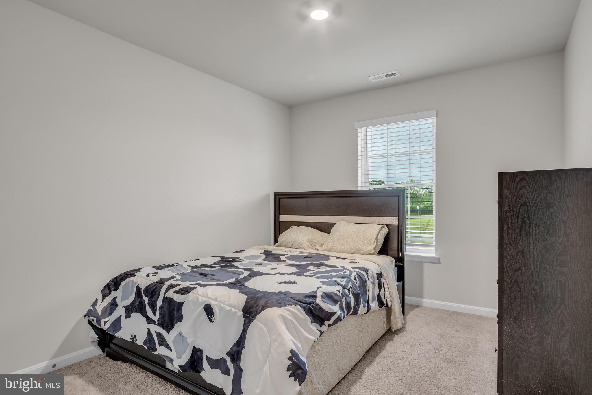 18 Smokehouse Road Carlisle, PA 17013 - Photo 26 of 33 a bedroom with a bed and wooden floor