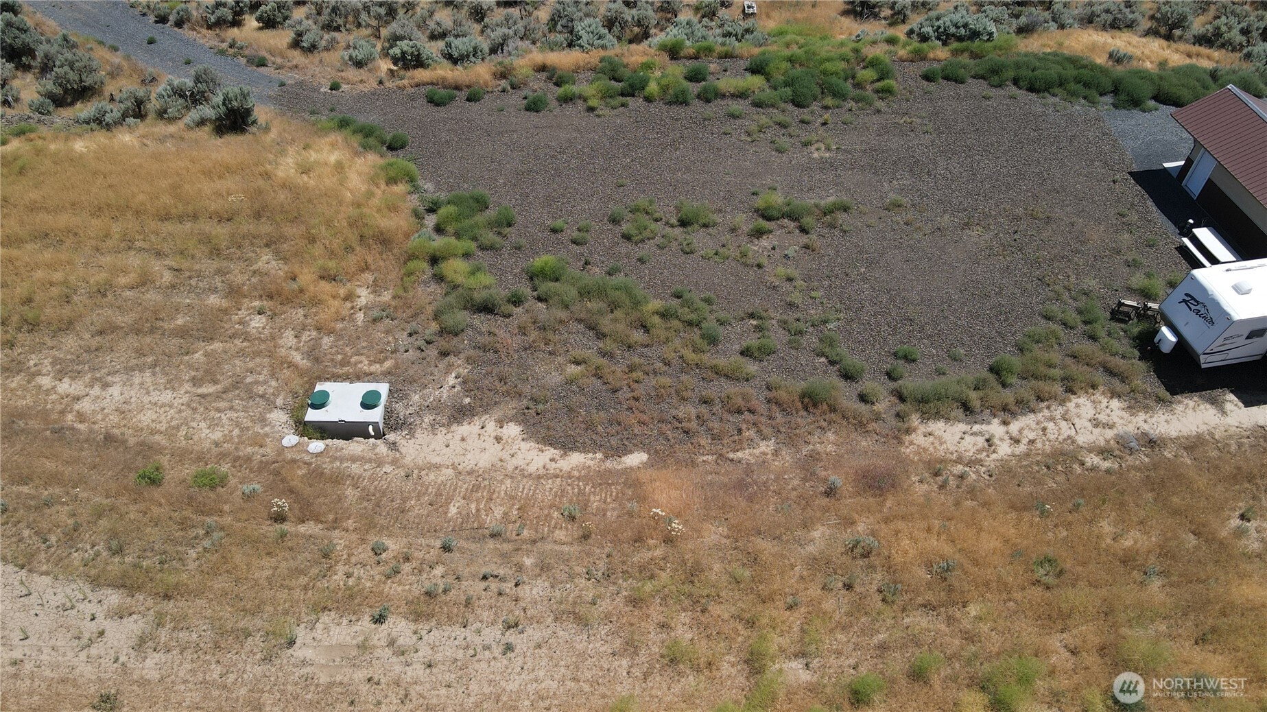 41 Banks Lake View Road, Unit 99115 Coulee City, WA 99115 - Photo 12 of 20 a view of a dry yard with wooden fence