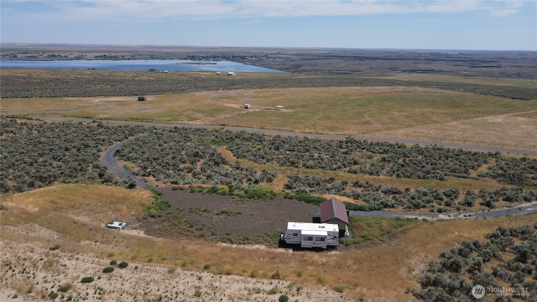 41 Banks Lake View Road, Unit 99115 Coulee City, WA 99115 - Photo 14 of 20 a view of a lake with a beach