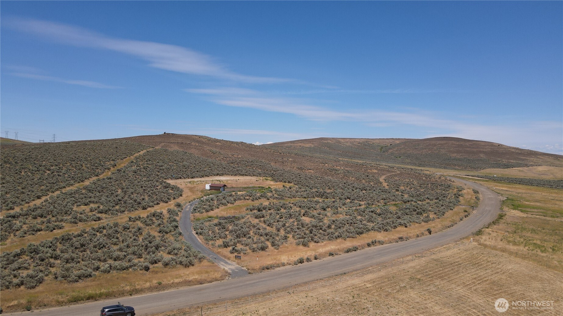 41 Banks Lake View Road, Unit 99115 Coulee City, WA 99115 - Photo 18 of 20 a view of a dry yard with mountains in the background