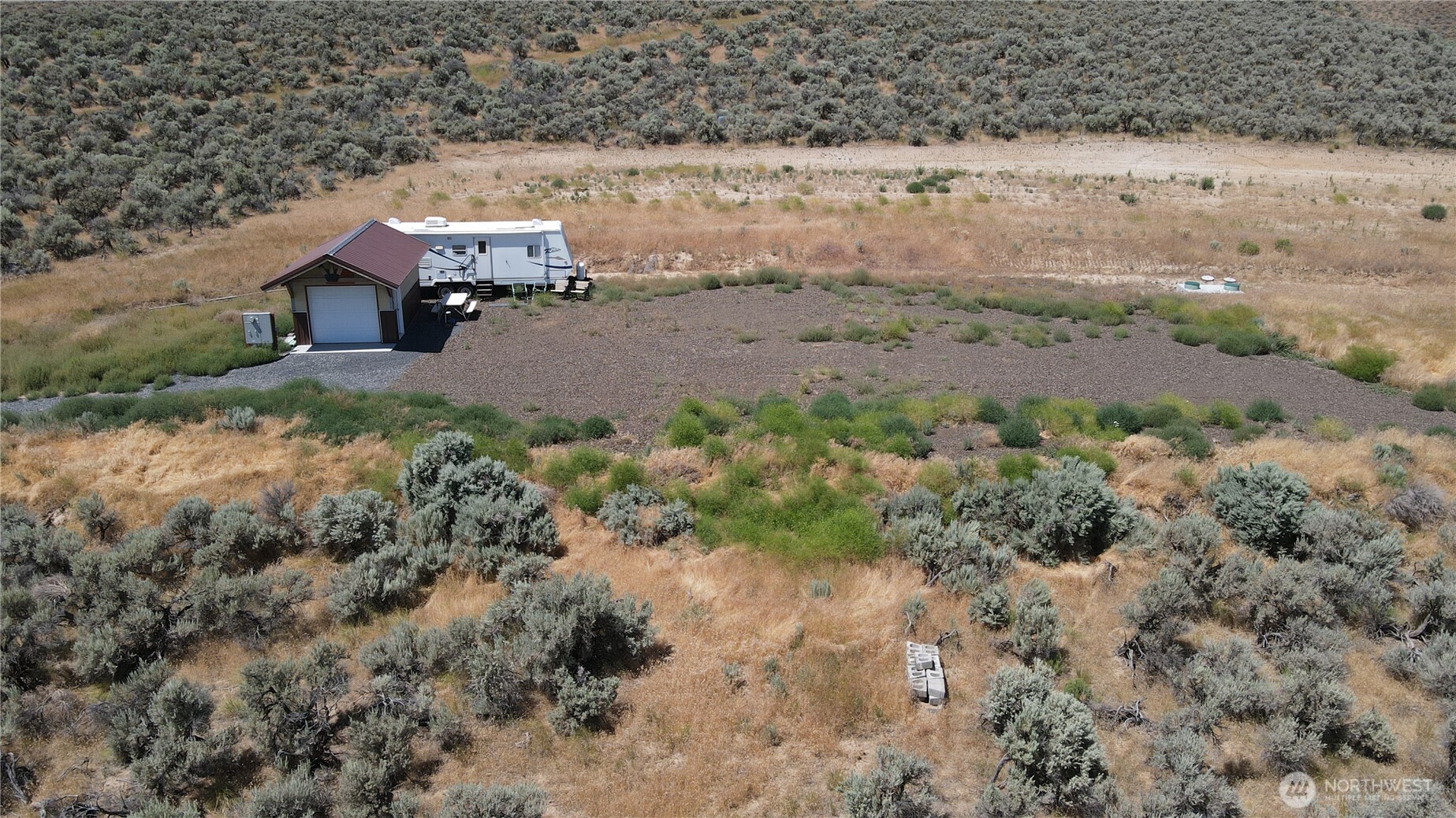 41 Banks Lake View Road, Unit 99115 Coulee City, WA 99115 - Photo 2 of 20 an aerial view of a house with a yard