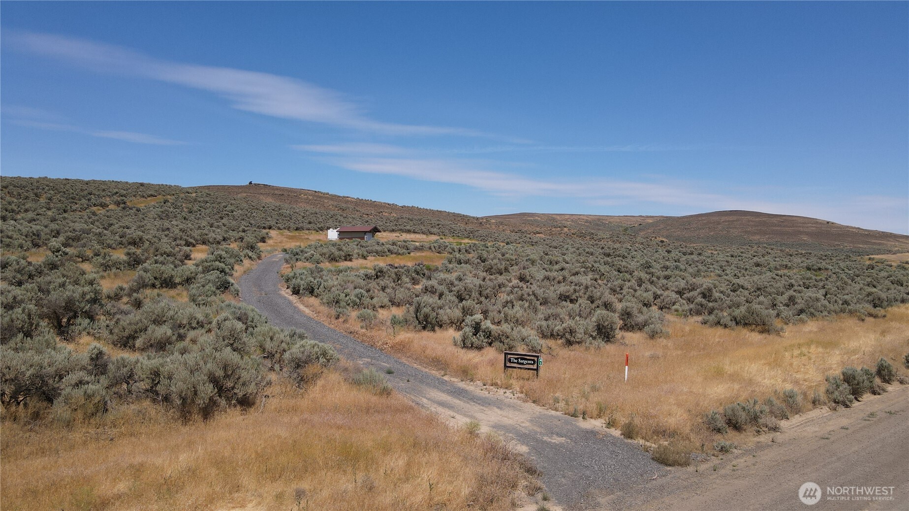 41 Banks Lake View Road, Unit 99115 Coulee City, WA 99115 - Photo 5 of 20 a view of a dry yard with mountains in the background