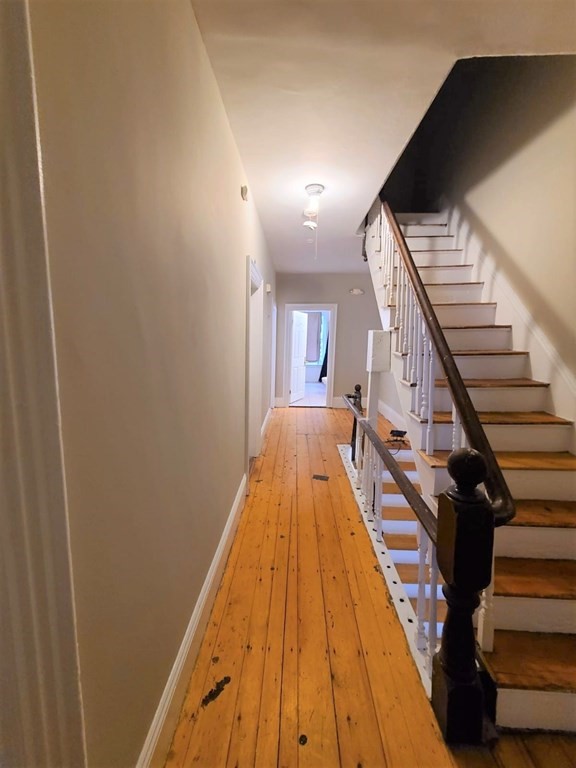 38 Gardner Street Boston, MA 02134 - Photo 9 of 11 a view of a living room with wooden floor