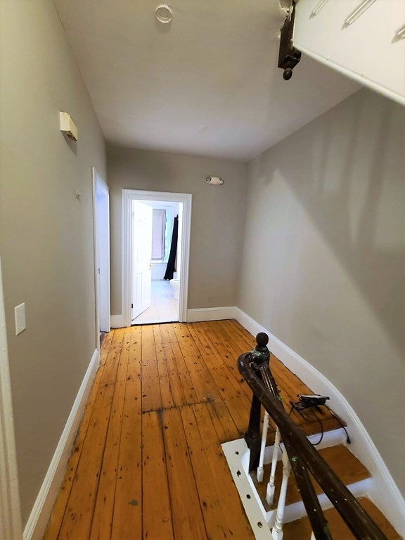 38 Gardner Street Boston, MA 02134 - Photo 10 of 11 a view of a room with wooden floor and staircase