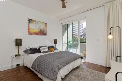 a spacious bedroom with bed and a window